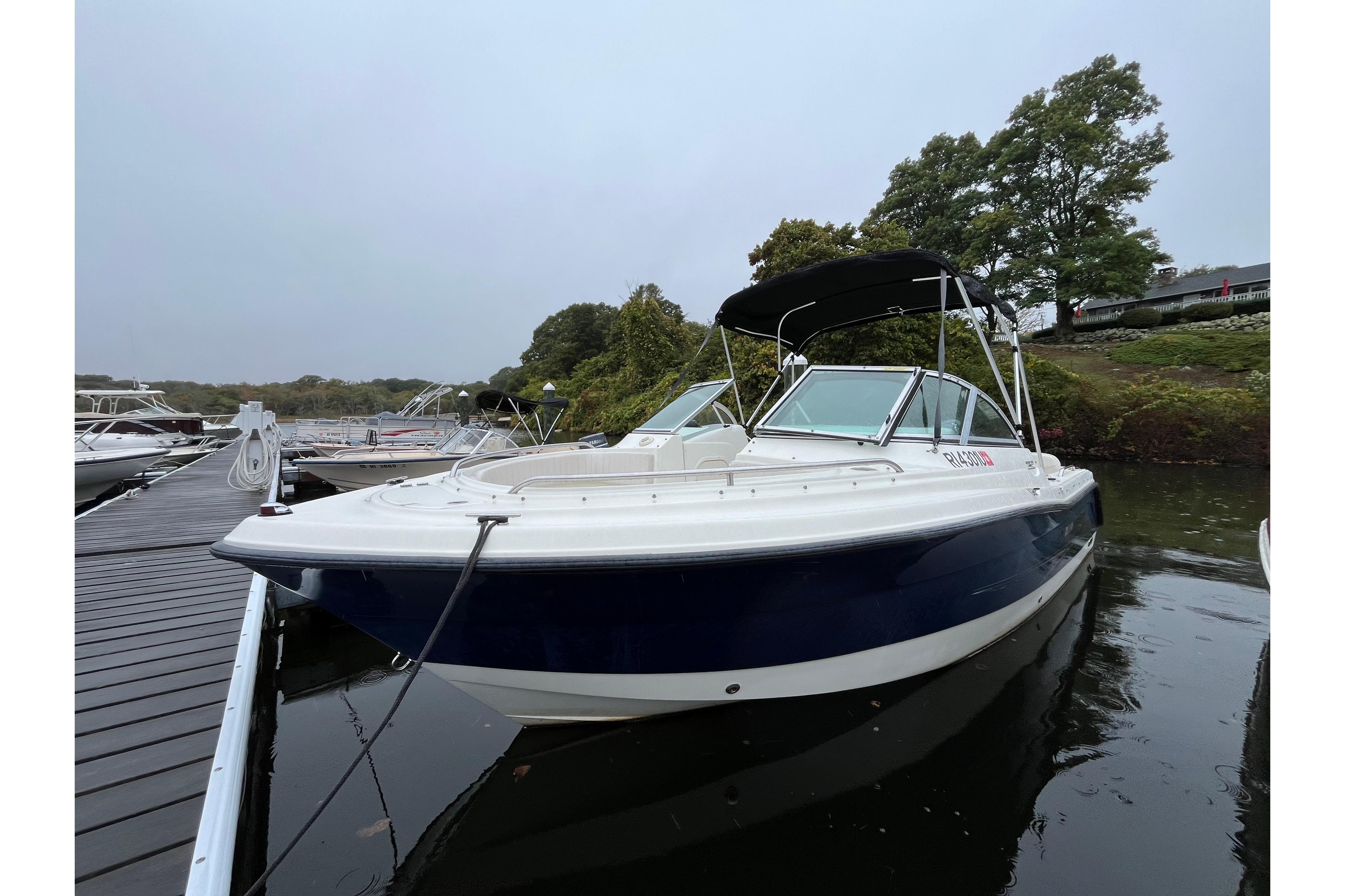 Hydra-Sports Lightning 202 DC 2006 Hydra-Sports Lightning 202 DC boat docked on calm water, overcast sky.