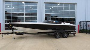 Donzi 22 Classic 2022 Donzi 22 Classic boat on trailer, parked outside a building with large windows.