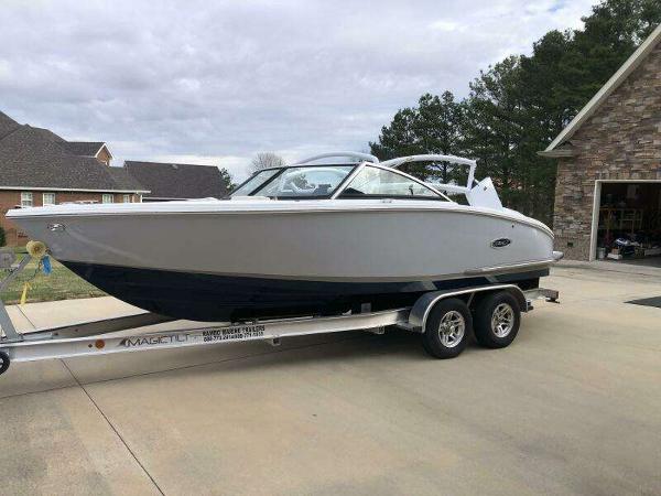 Cobalt CS22 2022 Cobalt CS22 boat on trailer in residential driveway.
