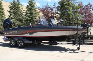 Nitro ZV21 2024 Nitro ZV21 fishing boat on trailer, parked outdoors.