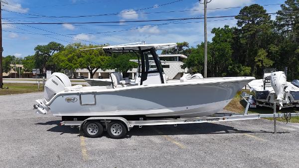 Sea Hunt Ultra 239 SE 2024 Sea Hunt Ultra 239 SE boat on a trailer, parked outdoors.