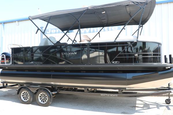 Sylvan Mirage X3 Party Fish 2025 Sylvan Mirage X3 Party Fish pontoon boat with canopy on trailer.