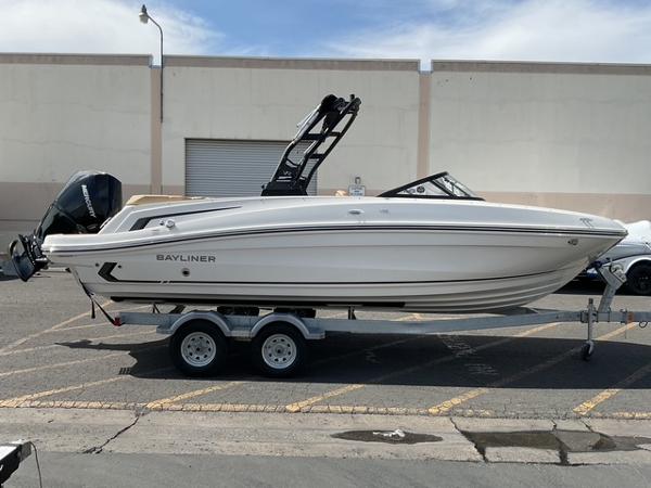 Bayliner VR6 Bowrider OB 2025 Bayliner VR6 Bowrider OB on trailer, parked outdoors, side view.