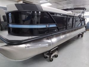 Sylvan L-5 SLZ 2026 Sylvan L-5 SLZ pontoon boat in a workshop.