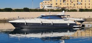 Innovazione e Progetti Innovazioni Alena 56 2007 Innovazioni Alena 56 yacht docked in a marina, reflecting on calm water.