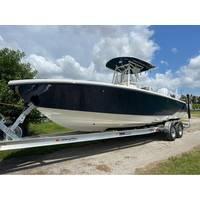 Pathfinder 2700 Open 2026 Pathfinder 2700 Open boat on trailer under cloudy sky.