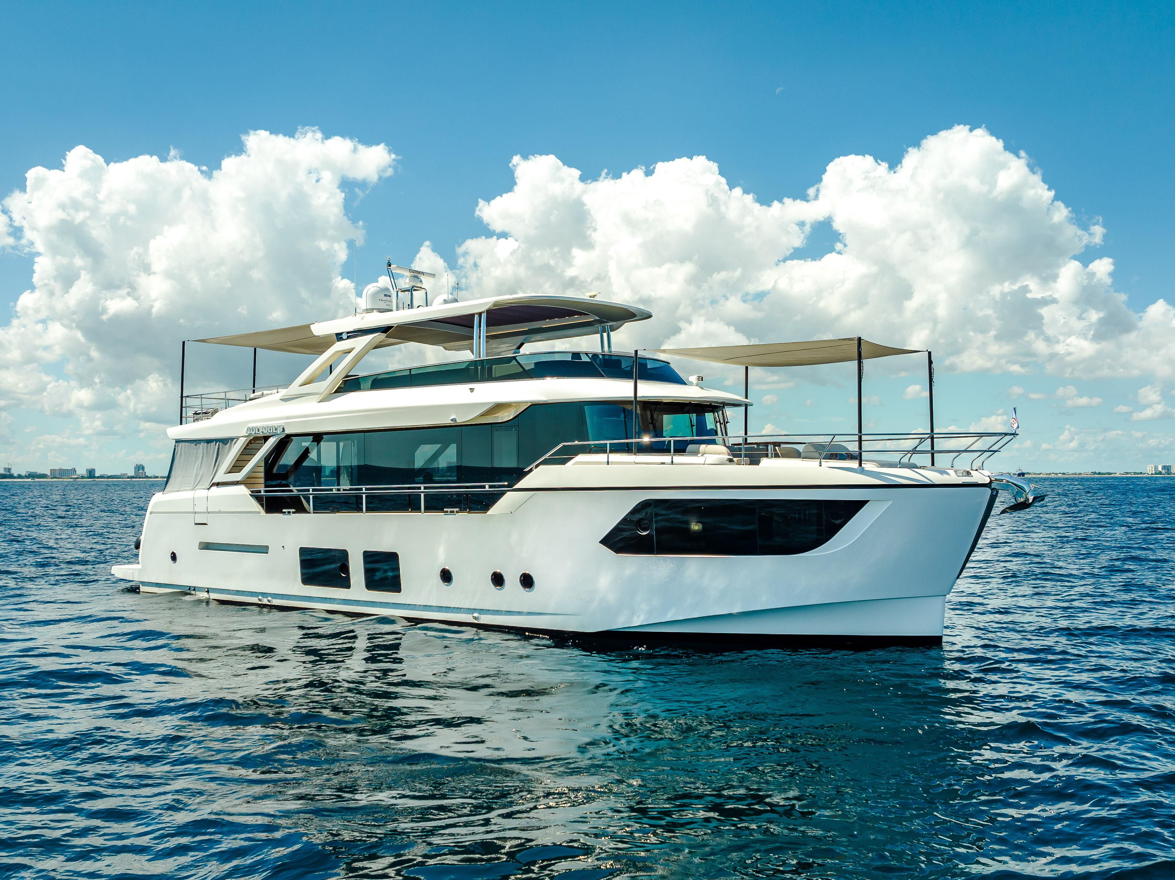 Absolute Navetta 73 Luxury Absolute Navetta 73 yacht cruising on open water, 2022 model.