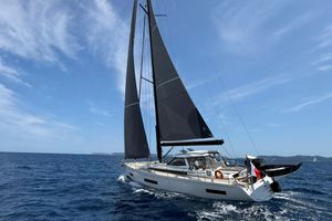Amel 50 Sailing yacht Amel 50, 2025 model, cruising on open sea under clear skies.