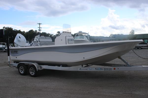 Carolina Skiff 23 LS 2025 Carolina Skiff 23 LS boat on trailer, parked outdoors under cloudy sky.