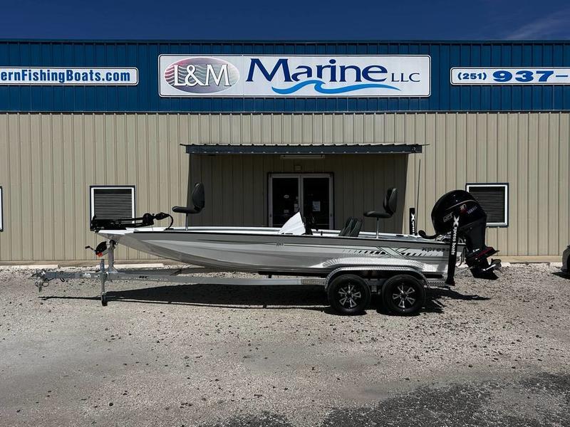 Xpress H20C Crappie 2025 Xpress H20C Crappie boat on trailer outside L&M Marine dealership.