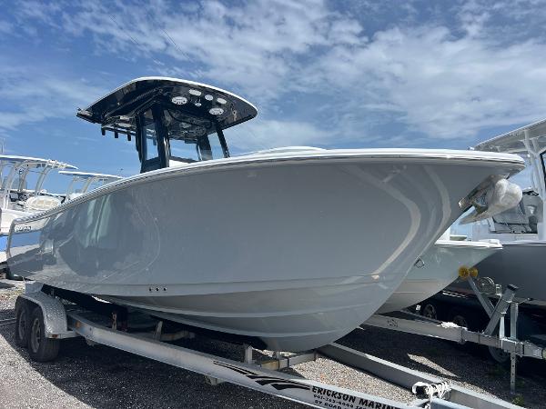 Sportsman Open 232 Center Console 2025 Sportsman Open 232 Center Console boat on trailer under blue sky.