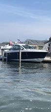Monterey 360 Sport Coupe 2017 Monterey 360 Sport Coupe docked by waterfront homes.