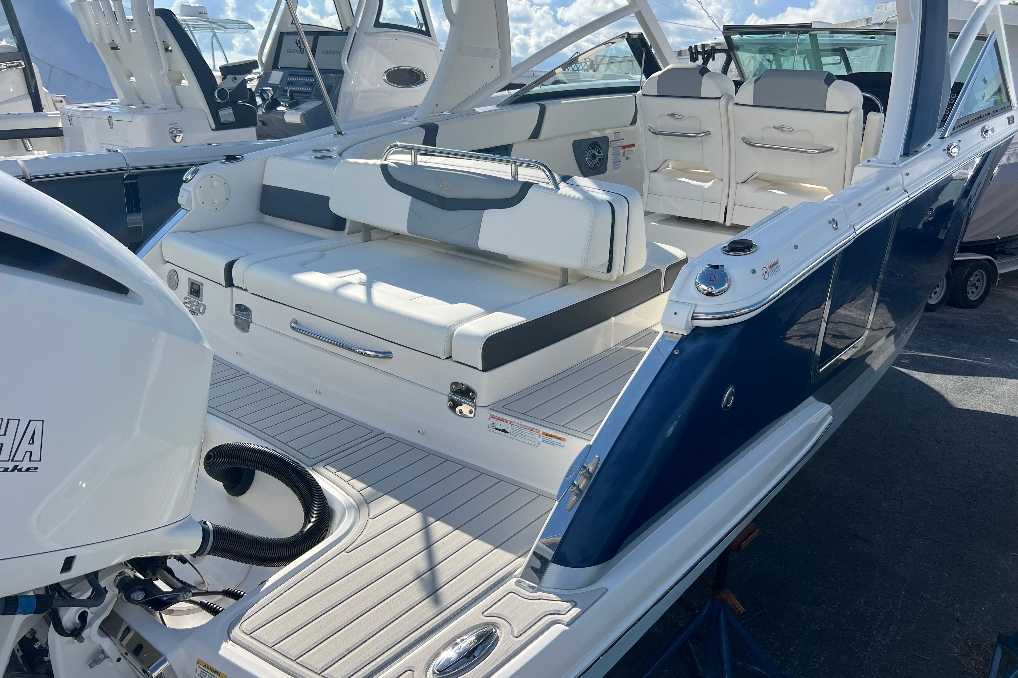 Chaparral 280 OSX 2020 Chaparral 280 OSX boat interior with seating and Yamaha engine.