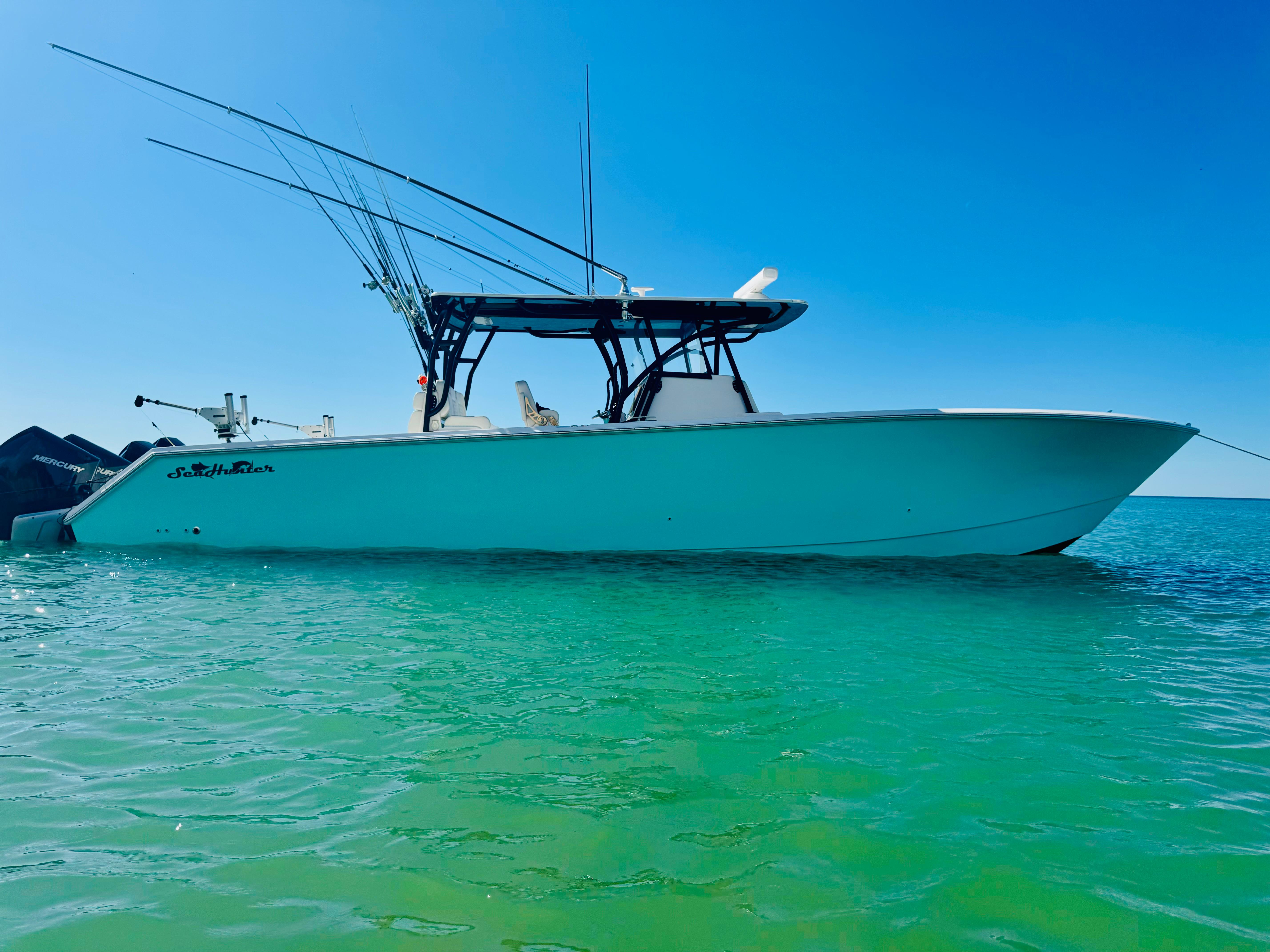 SeaHunter 41 CTS 2020 SeaHunter 41 CTS boat on clear turquoise water under blue sky.