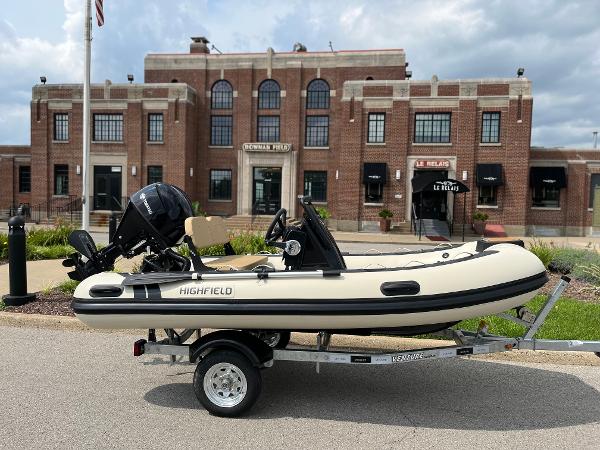 Highfield Classic 360 GT 2025 Highfield Classic 360 GT boat on trailer, parked in front of a historic brick building.
