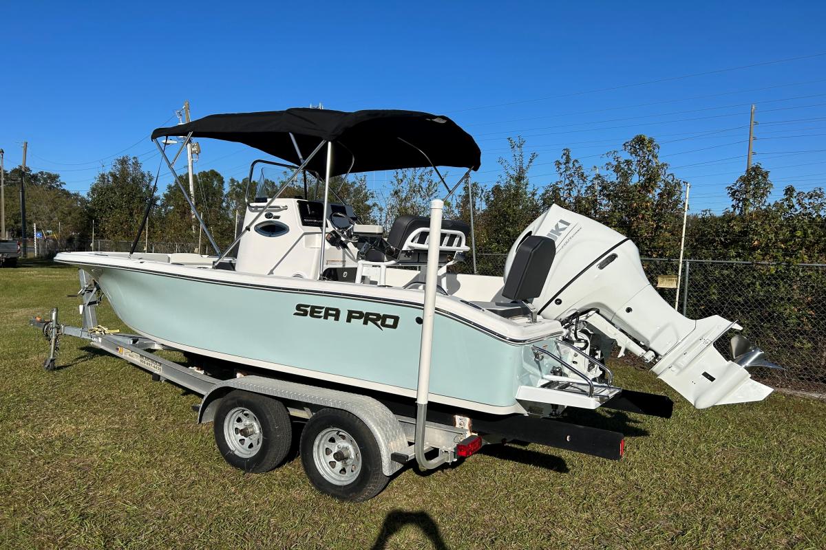 Sea Pro 202 CC 2025 Sea Pro 202 CC boat on trailer, featuring a sleek design and outboard motor.