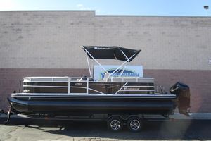 Ranger Reata 243C 2024 Ranger Reata 243C pontoon boat with canopy, displayed on a trailer.