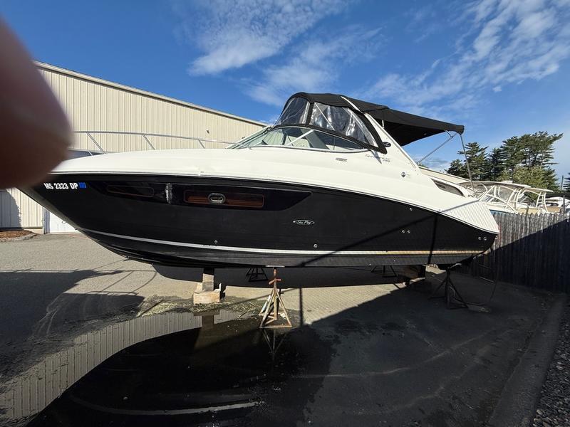 Sea Ray 280 Sundancer 2014 Sea Ray 280 Sundancer boat on stands, outdoors under a clear sky.