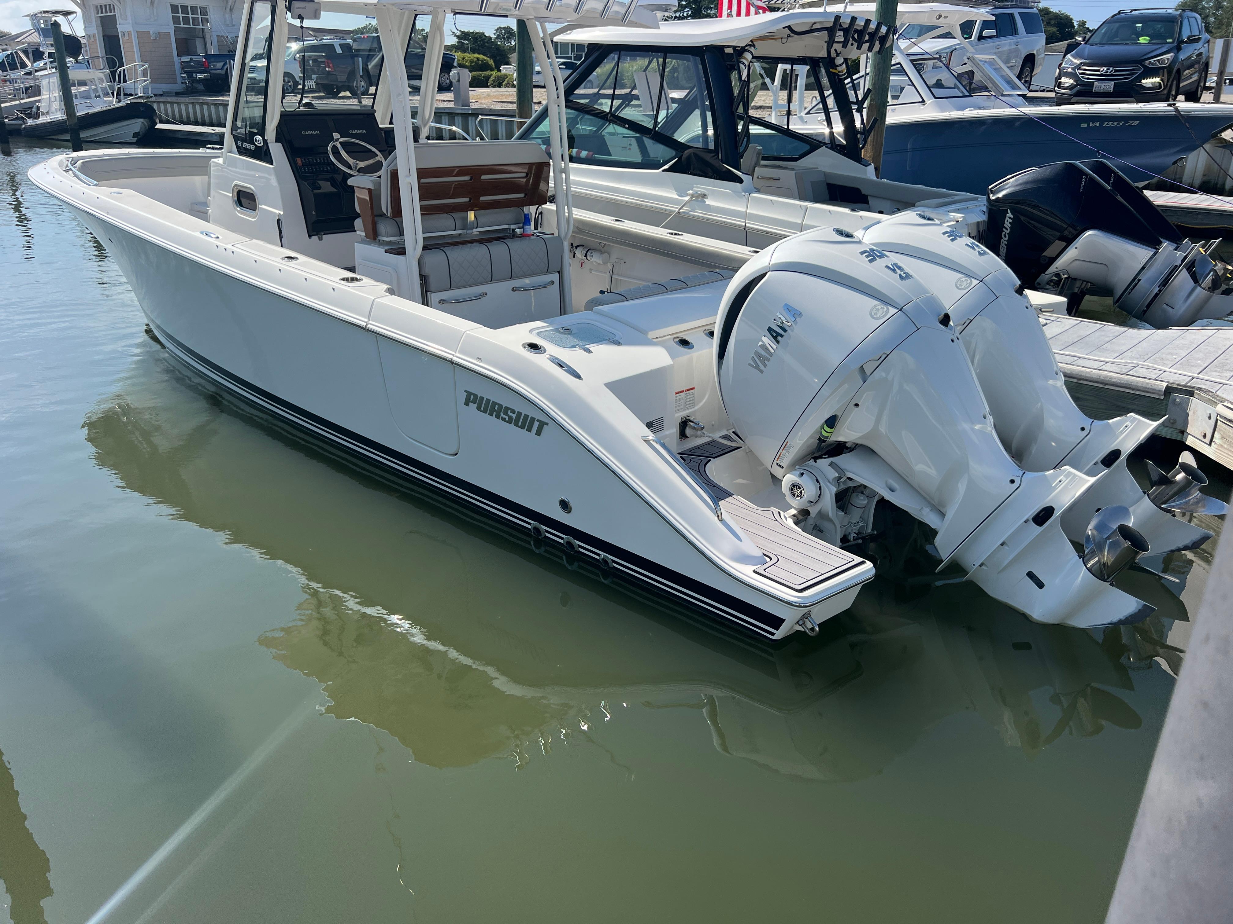 Pursuit S 288 Sport 2023 Pursuit S 288 Sport boat docked with twin Yamaha outboard engines.