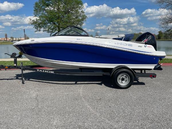 Tahoe 185 S 2024 Tahoe 185 S boat on trailer, blue and white design, parked outdoors.