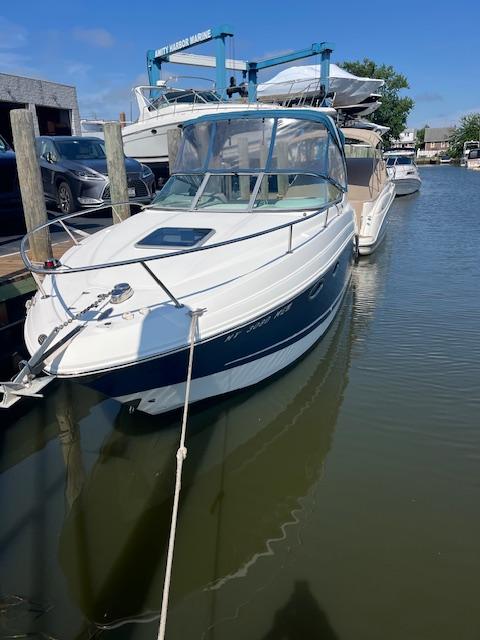 Chaparral Signature 250 2008 Chaparral Signature 250 boat docked at a marina, clear blue sky.