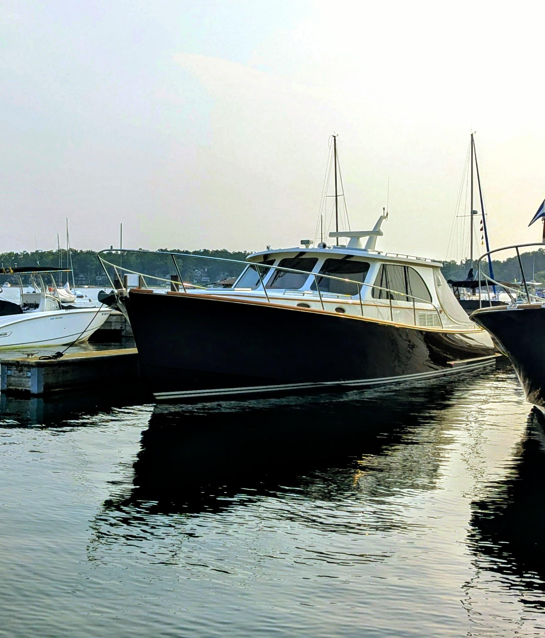Hinckley Talaria 43 2022 Hinckley Talaria 43 yacht docked in a serene marina setting.