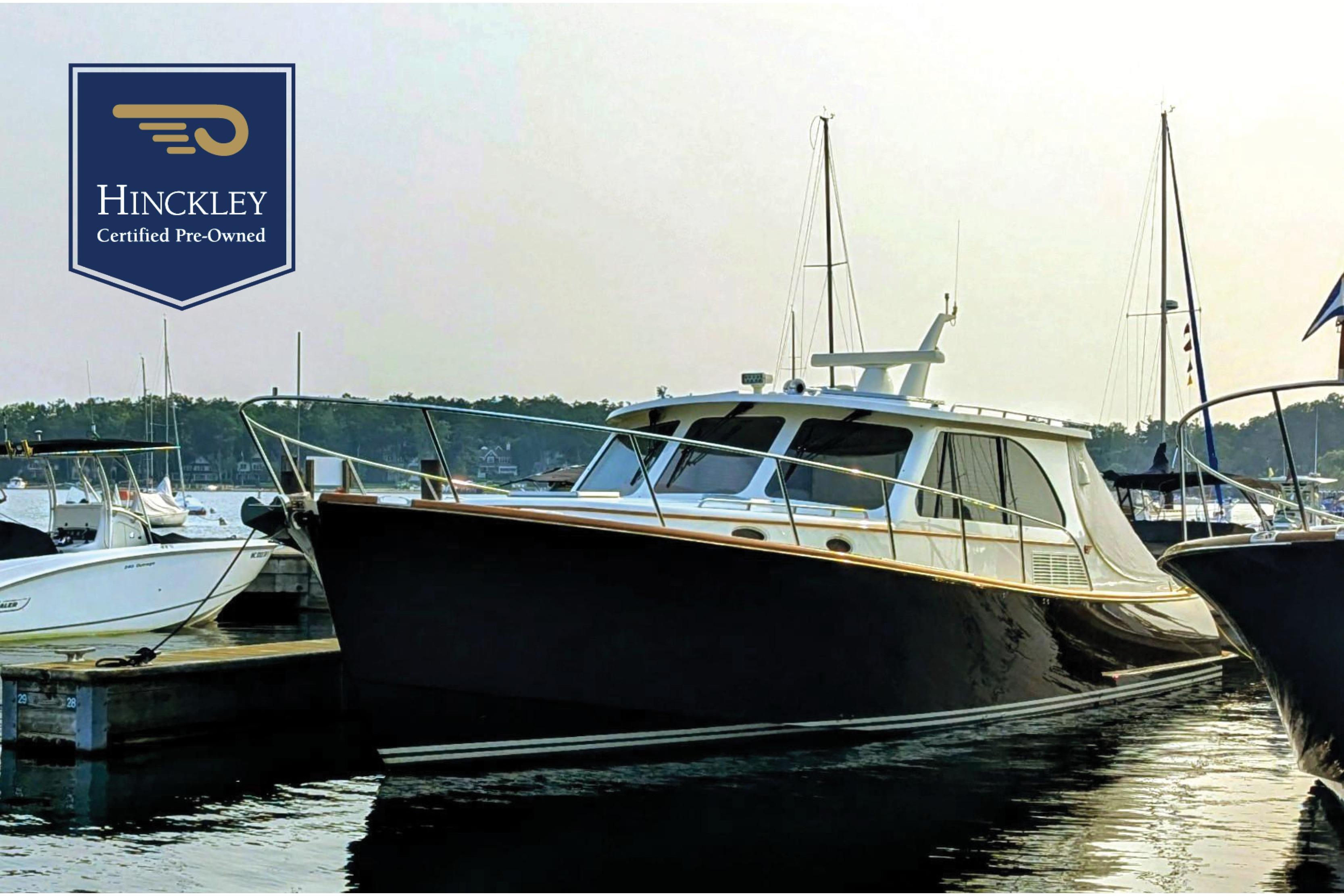 Hinckley Talaria 43 Hinckley Talaria 43 yacht, 2022 model, docked with certified pre-owned badge.
