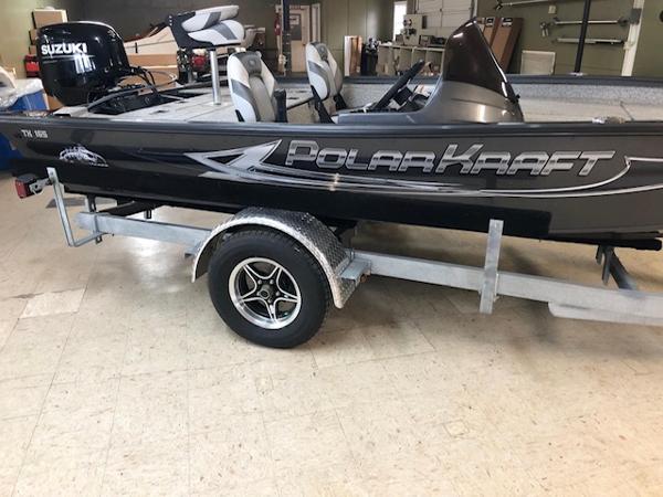 Polar Kraft 165BATX 2023 Polar Kraft 165BATX boat on trailer in indoor setting.