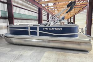 Premier 200 Sunscape 2025 Premier 200 Sunscape pontoon boat in a warehouse setting.