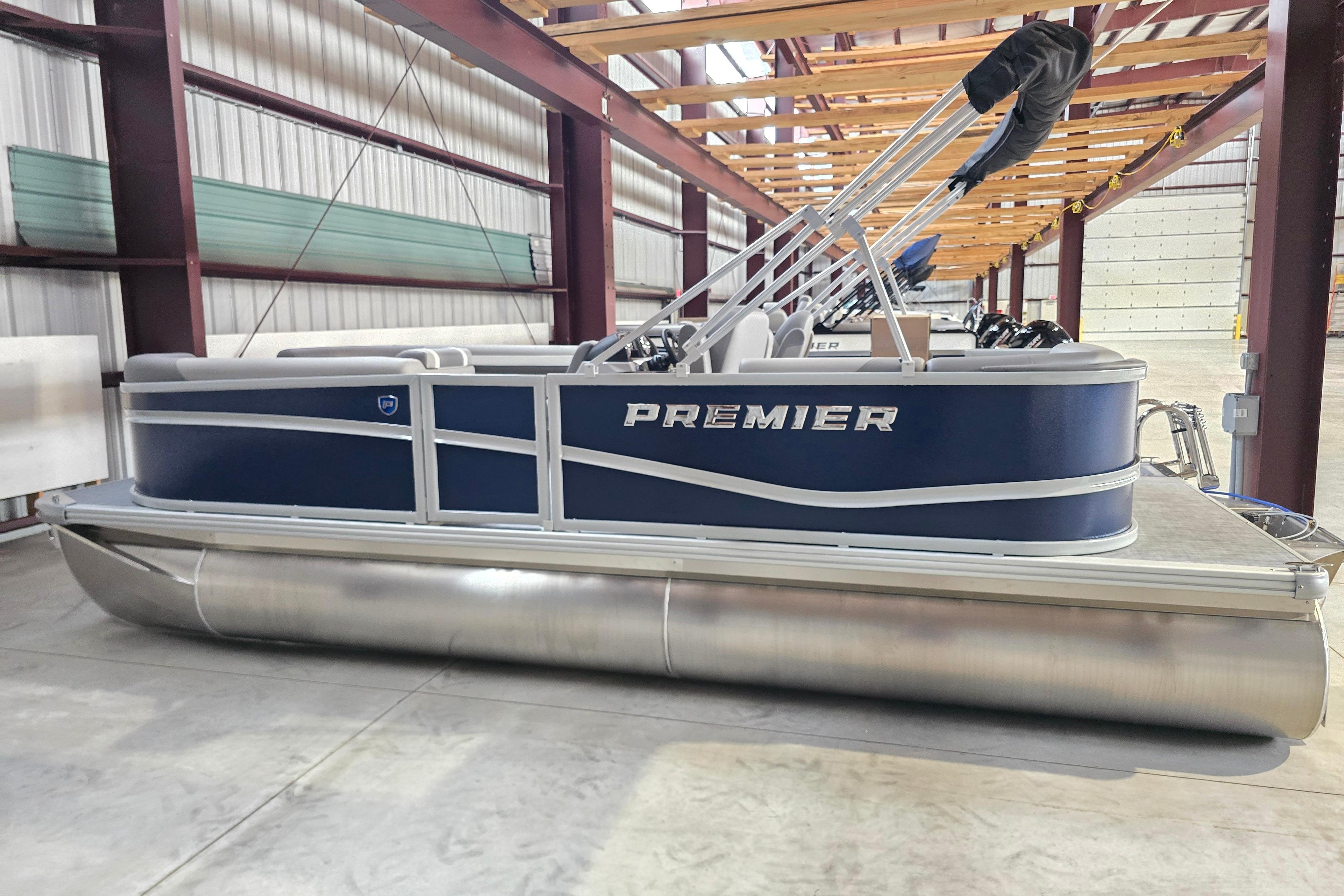 Premier 200 Sunscape 2025 Premier 200 Sunscape pontoon boat in a warehouse setting.