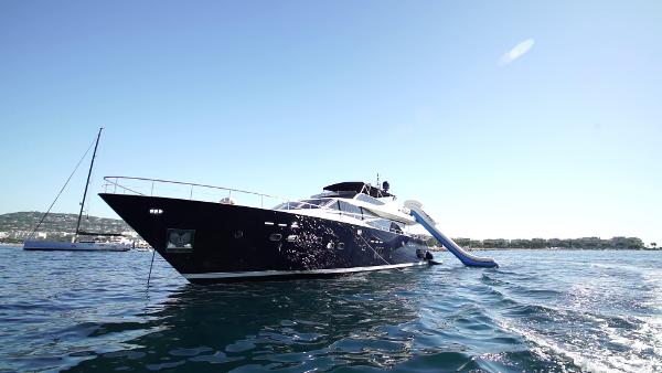 Guy Couach 2800 Luxury 2006 Couach 2800 yacht with slide on open water.