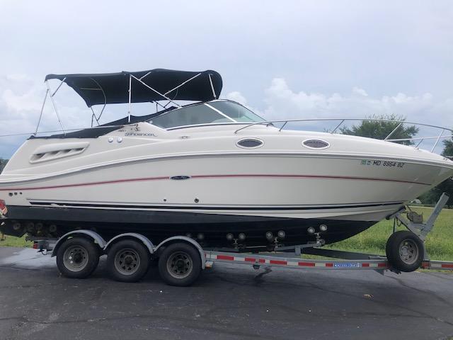 Sea Ray 260 Sundancer 2008 Sea Ray 260 Sundancer boat on a trailer with a black canopy.