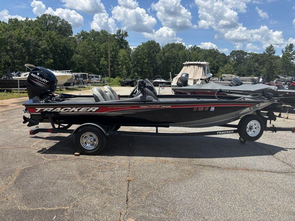 Tracker Pro Team 175 TXW 2018 Tracker Pro Team 175 TXW boat on trailer, parked outdoors under a blue sky.