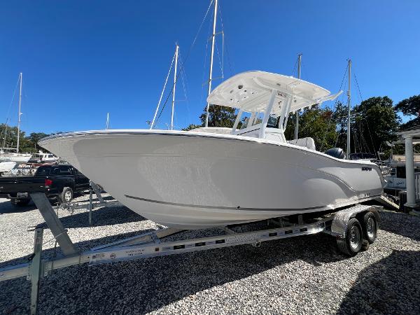 Sea Fox 228 Commander 2025 Sea Fox 228 Commander boat on trailer under clear blue sky.