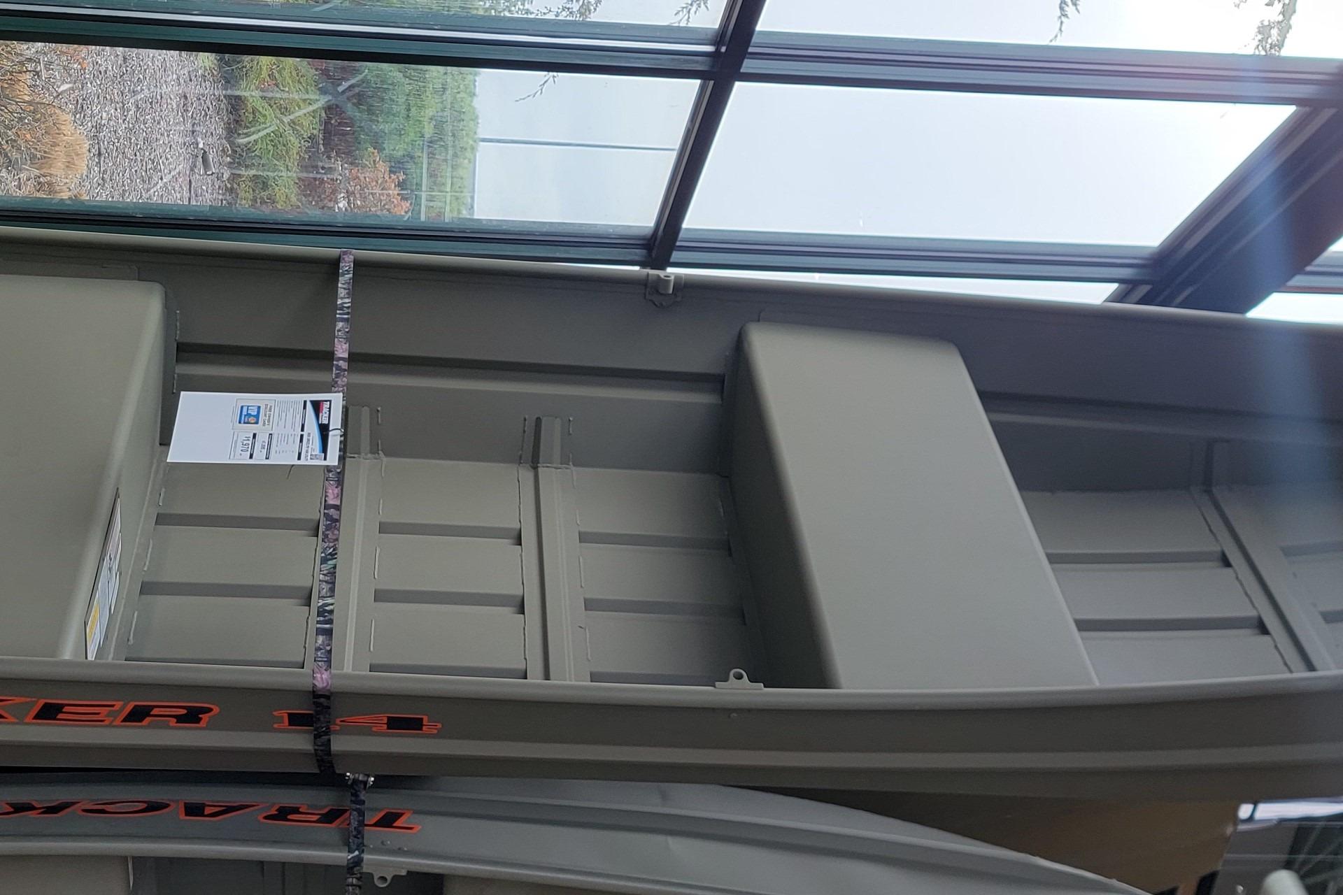 Tracker Grizzly 14 Jon 2025 Tracker Grizzly 14 Jon boat displayed indoors, showcasing interior design.