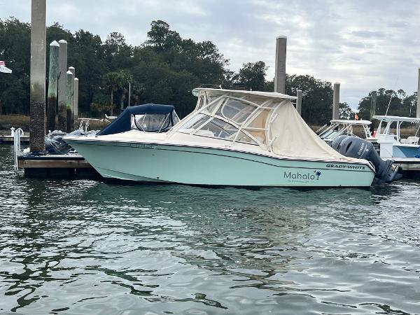 Grady-White Freedom 255 2021 Grady-White Freedom 255 boat docked at marina with canopy cover.