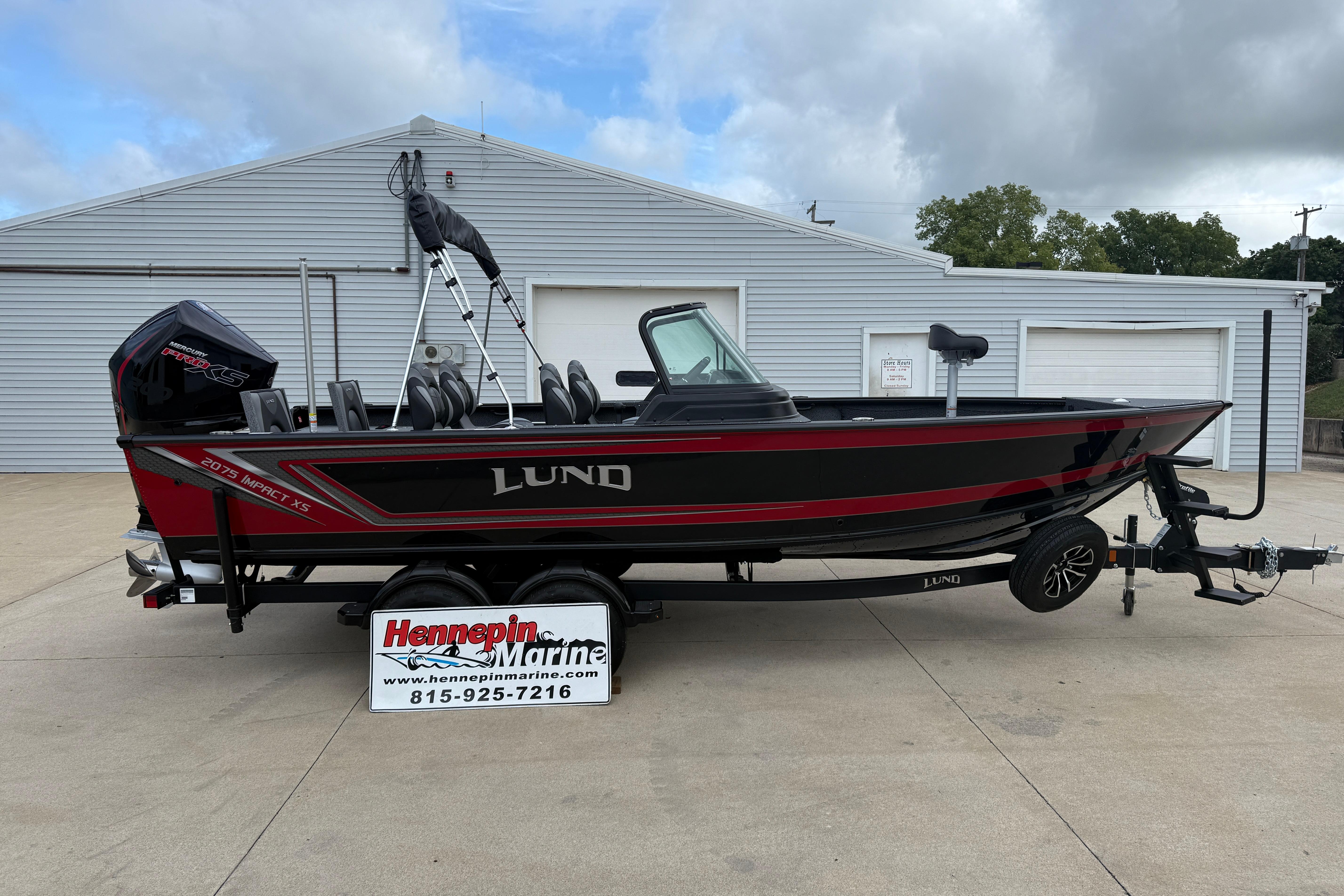 Lund 2075 Impact XS 2026 Lund 2075 Impact XS boat on trailer, displayed at Hennepin Marine dealership.