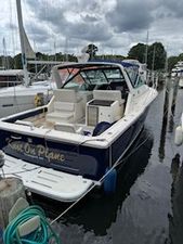 Tiara Yachts 33' Open 1996 Tiara Yachts 33' Open boat docked in a marina under cloudy skies.
