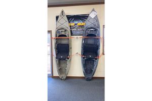 Ascend FS10 Sit-In - Titanium Two Ascend FS10 Sit-In kayaks, 2022 model, displayed vertically on a wall.