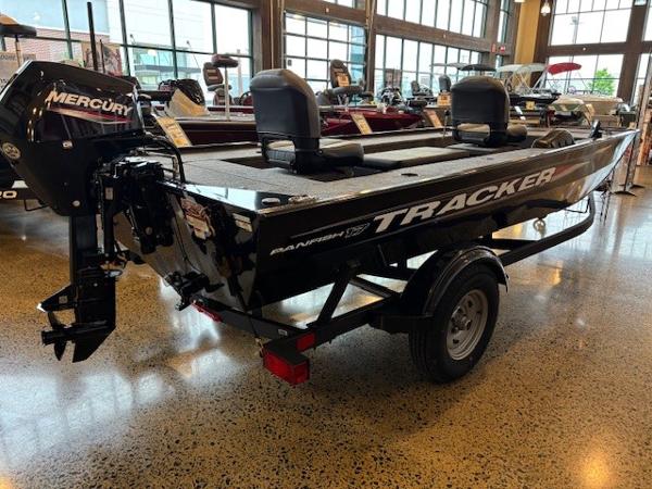 Tracker Panfish 17 2025 Tracker Panfish 17 boat with Mercury engine displayed indoors.
