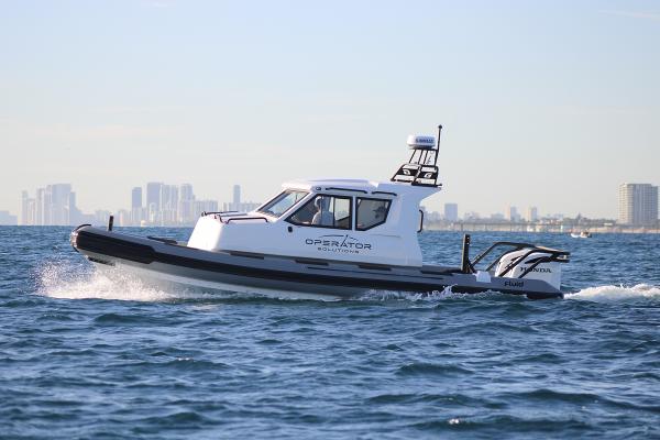 Fluid Watercraft Patrol 880 Cabin 2022 Fluid Watercraft Patrol 880 Cabin boat cruising on open water.