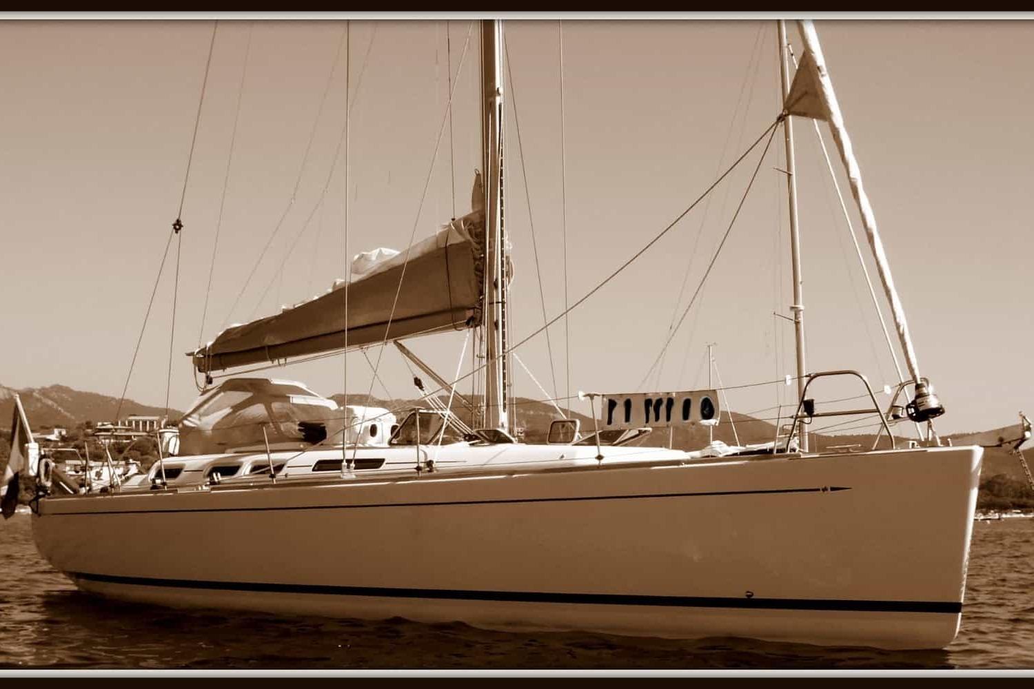 Grand Soleil 45 Sepia-toned image of a 2003 Grand Soleil 45 sailboat on calm waters.