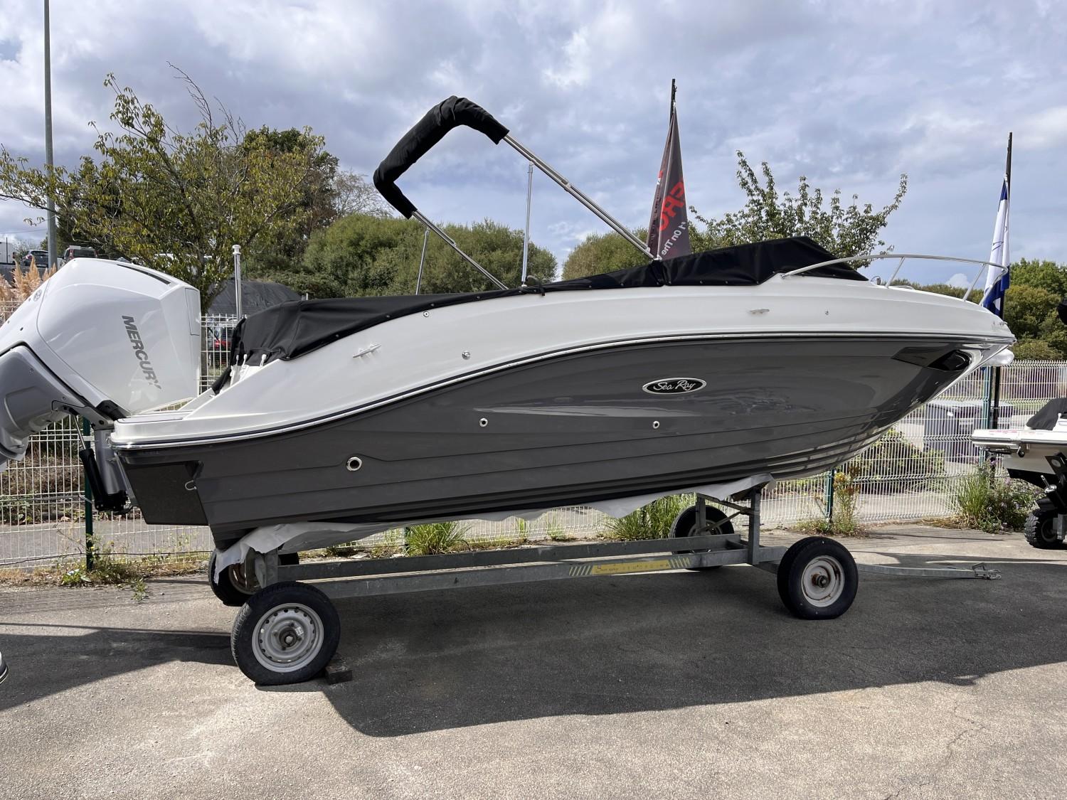 Sea Ray Sun Sport 230 2023 Sea Ray Sun Sport 230 boat on trailer, outdoor display.