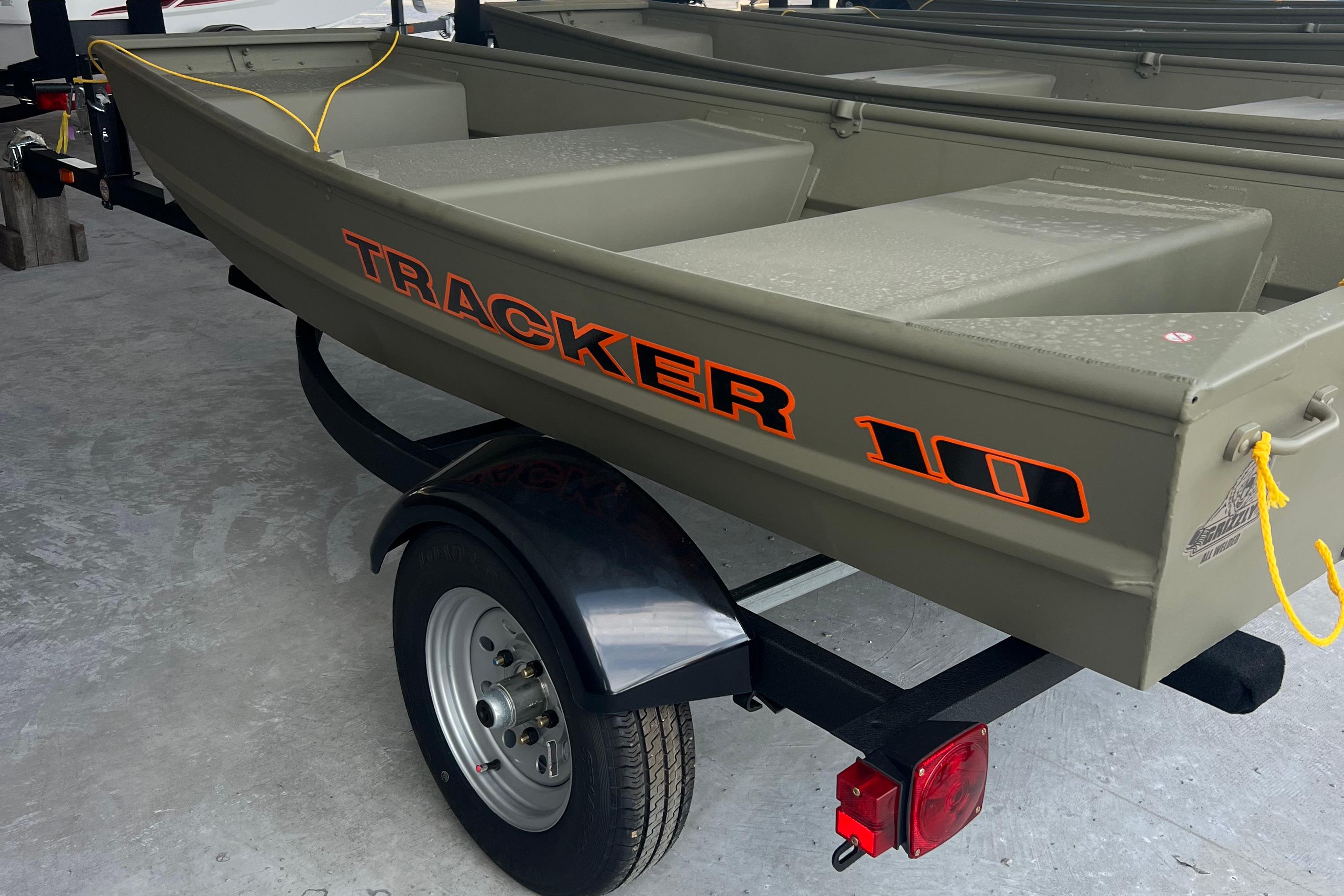 Tracker Grizzly 10 Jon 2026 Tracker Grizzly 10 Jon boat on trailer, featuring durable design and bold lettering.