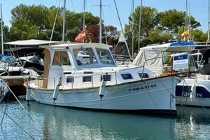 Llaut Bennasar Aucanada 37 2004 Llaut Bennasar Aucanada 37 boat docked, for sale, in a marina setting.