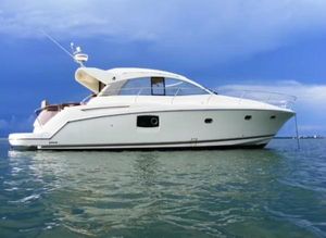 Prestige 440 S 2012 Prestige 440 S yacht on calm waters under a blue sky.