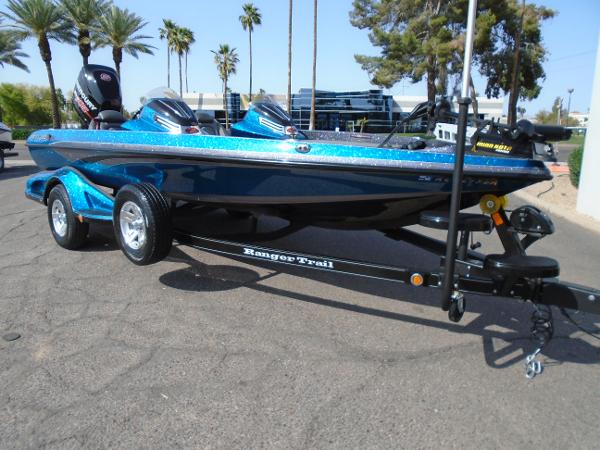 Ranger Z518 Comanche 2018 Ranger Z518 Comanche boat on trailer, parked outdoors with palm trees in the background.