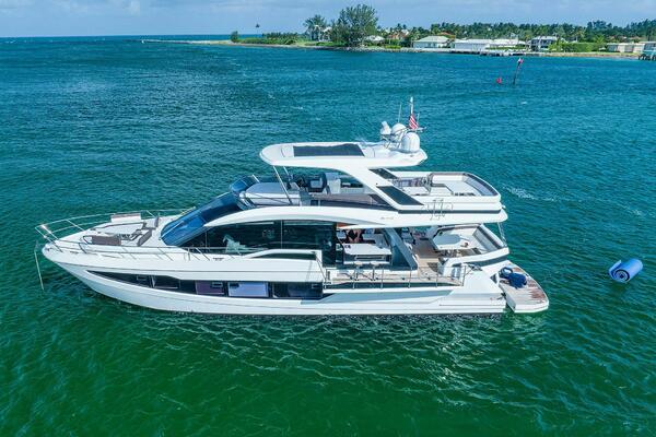 Galeon 640 Fly 2019 Galeon 640 Fly yacht cruising on clear blue waters.