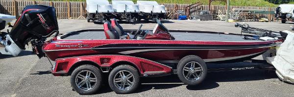 Ranger Z521R Ranger Cup Equipped 2024 Ranger Z521R Ranger Cup Equipped boat, red and black, on a trailer in a parking lot.