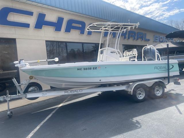 Robalo 206 Cayman 2023 Robalo 206 Cayman boat on trailer outside dealership.